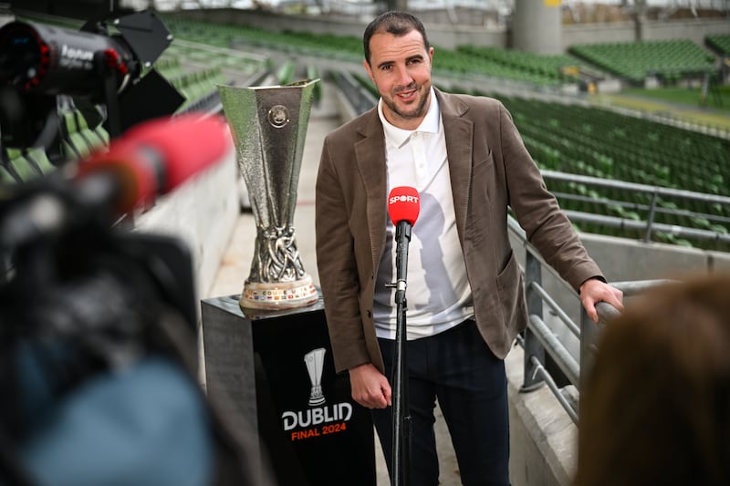 Europa League Final ambassador John O'Shea with the trophy at the Aviva Stadium. Photograph: Stephen McCarthy/Sportsfile