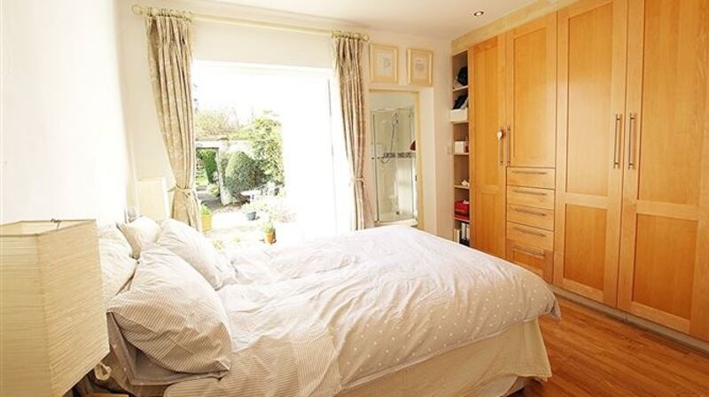 The main bedroom of 14 Station Road cottages opens onto a sunny patio