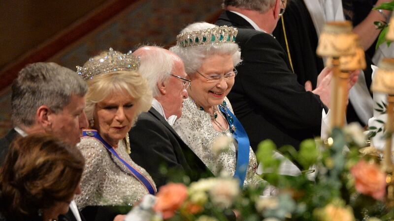Heads of state: Michael D Higgins talks to Queen Elizabeth at Windsor Castle in 2014. Photograph: Alan Betson
