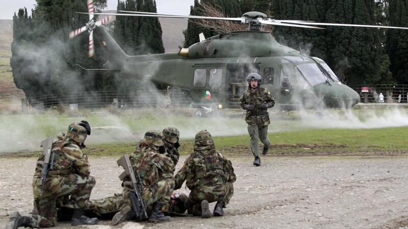 An Aer Corps helicopter lands to extract an injured soldier during an excercise in which 129 Defence Forces soldiers from the 44 Infantry Group entered the final phase of intense training in preparation for their forthcoming deployment to the United Nations Disengagement Observation Force, (UNDOF) based in the Golan Heights region of Syria. Photograph: Colin Keegan/Collins