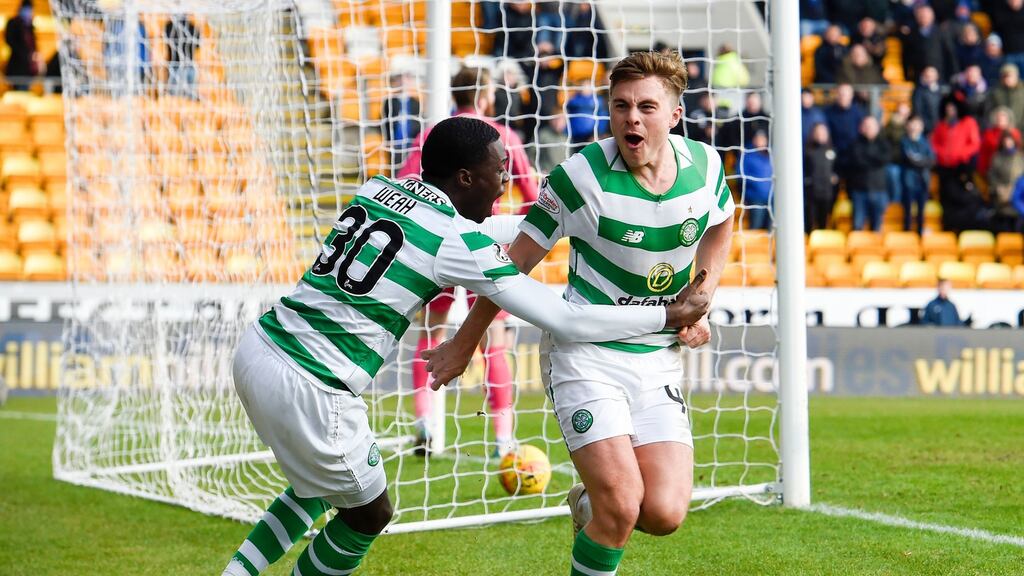 James Forrest and Timothy celebrate Celtic’s first goal against St Johnstone. Photograph: Ian Rutherford/PA