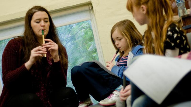 Back to school: Anna Friel teaches tin whistle
