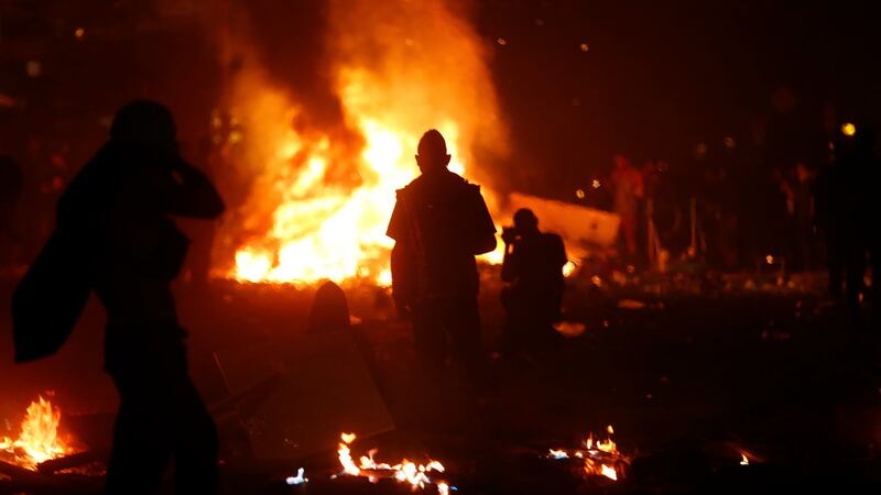 Protesters gather near a burning barricade during demonstrations at the G20 summit in Hamburg. Photograph:  REUTERS/Hannibal Hanschke