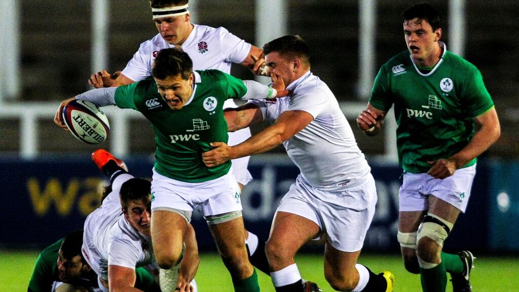 Ireland’s Johnny McPhillips bursts by England’s Jack Singleton during his team’s comeback victory in Newcastle. Photograph: Alex Dodd/Inpho