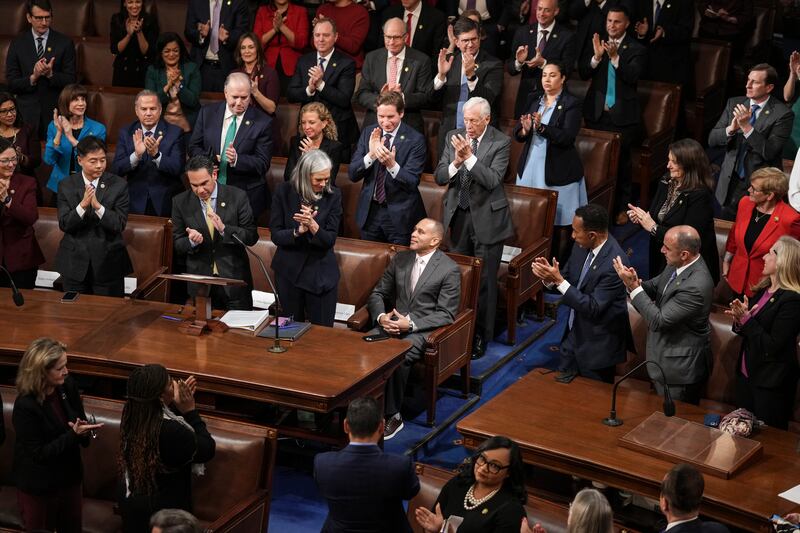 Democrat Hakeem Jeffries (centre) remains seated as fellow members of the US House of Representatives applaud, as voting for the next speaker of the house commenced for a second day, at the Capitol in Washington DC on Wednesday. Photograph: Haiyun Jiang/The New York Times