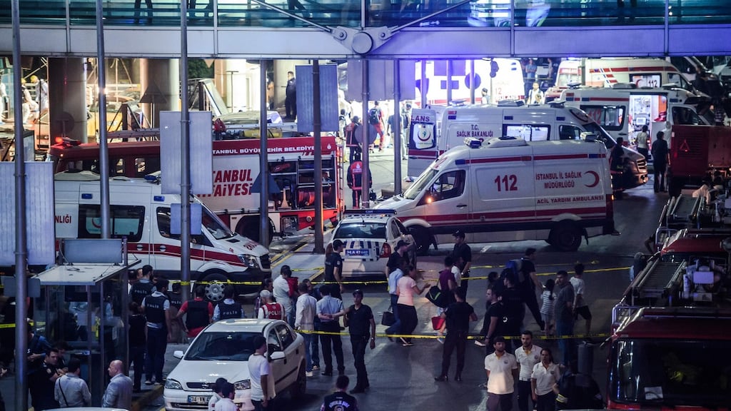 Forensic police work the explosion site at Ataturk airport. Photograph: AFP/Getty Images