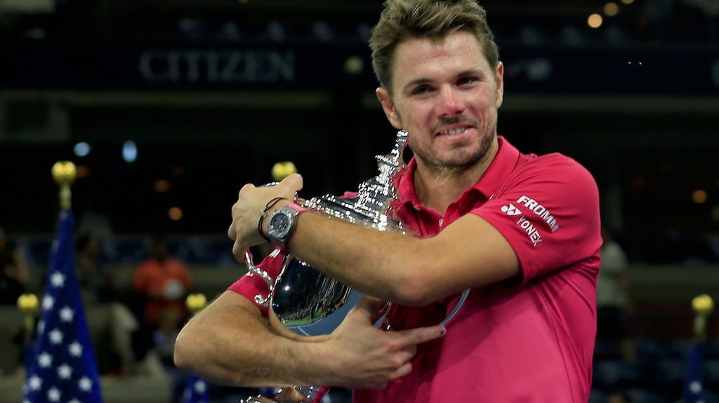 Stan Wawrinka of Switzerland celebrates with the trophy after winning 6-7, 6-4, 7-5, 6-3 against Novak Djokovic of Serbia in the US Open final. Photograph: Getty Images