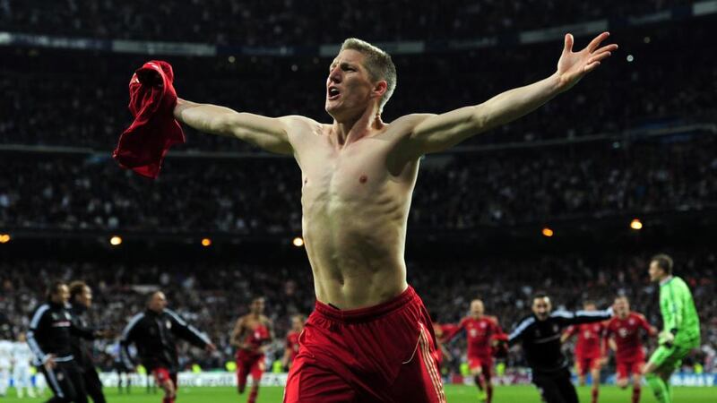 Bastian Schweinsteiger wheels away after scoring against Real Madrid in the European Champions League. Photograph: Shaun Botterill/Getty Images