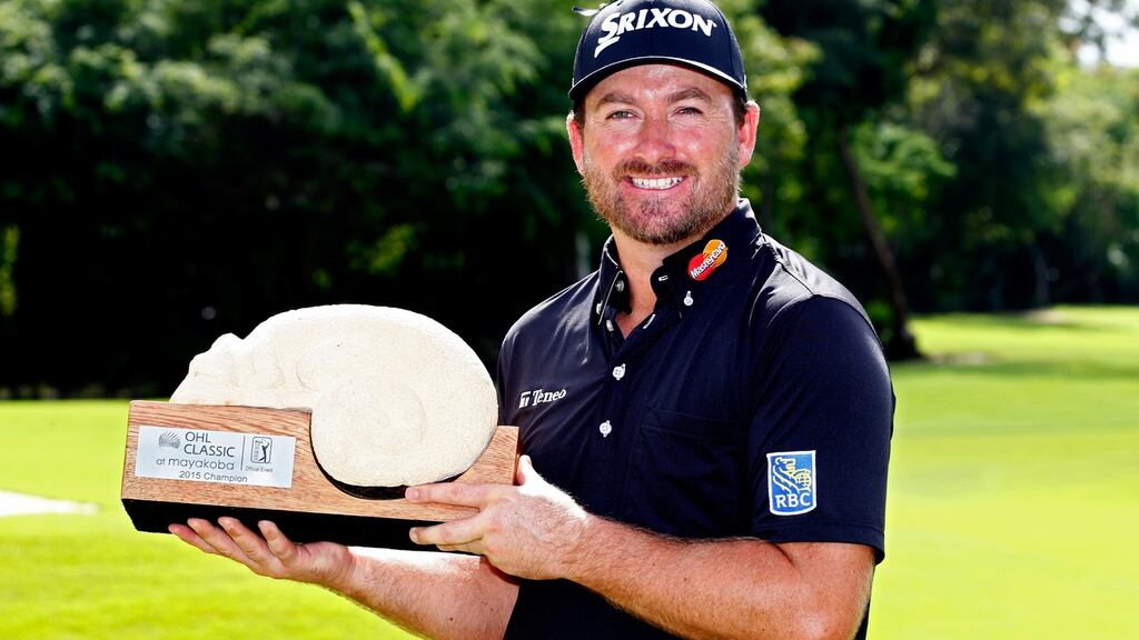 Graeme McDowell poses with the trophy after winning the three man play-off in the final round of the OHL Classic in Mexico. Photo: Jamie Squire/Getty Images
