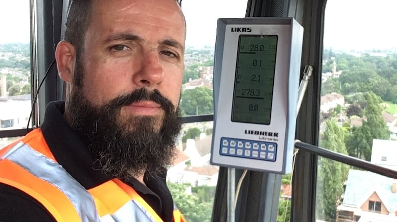 Rob Kelly, organiser with the Unite trade union, in the cab of a crane
