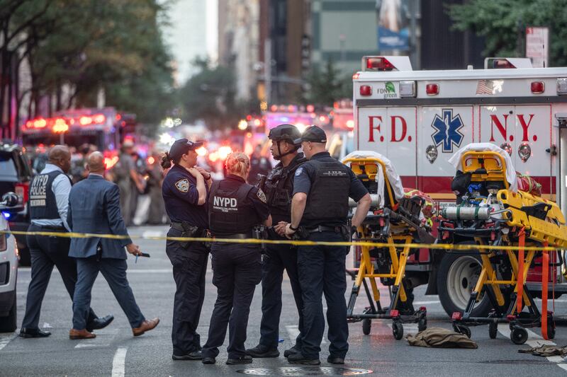New York Police Department officers at the scene of the shooting. Photograph: Victor J Blue/Bloomberg