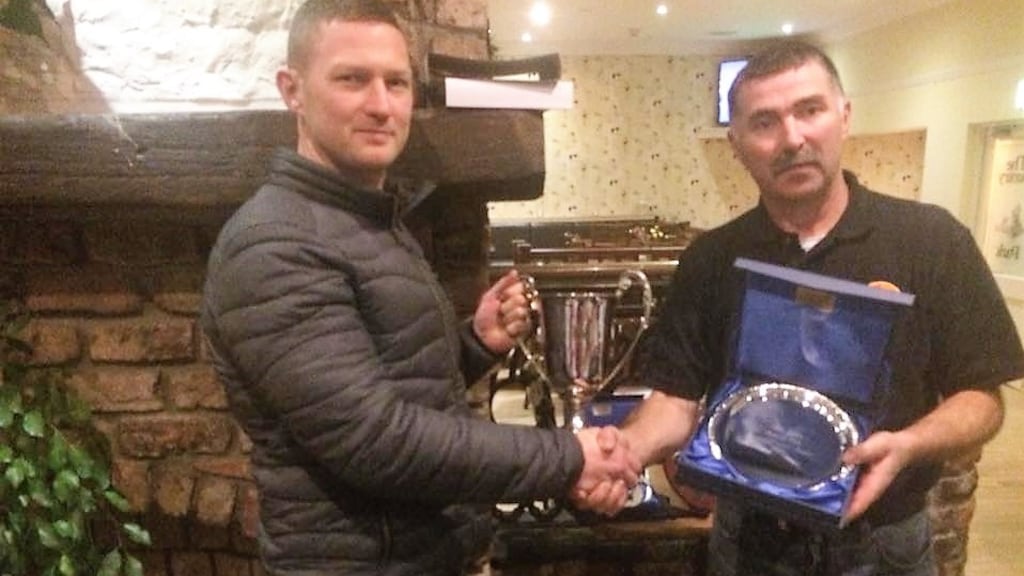 Ruairi Coleman (left), South Shore Master Angler 2017, receiving the MA Cup from club member Thomas Keogh