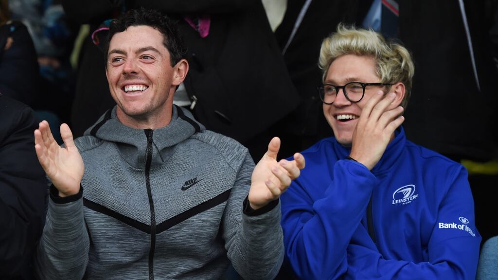 Rory McIlroy attends an Ulster v Leinster rugby match with Niall Horan – one of the many interests he has away from the course. Photo: Getty Images