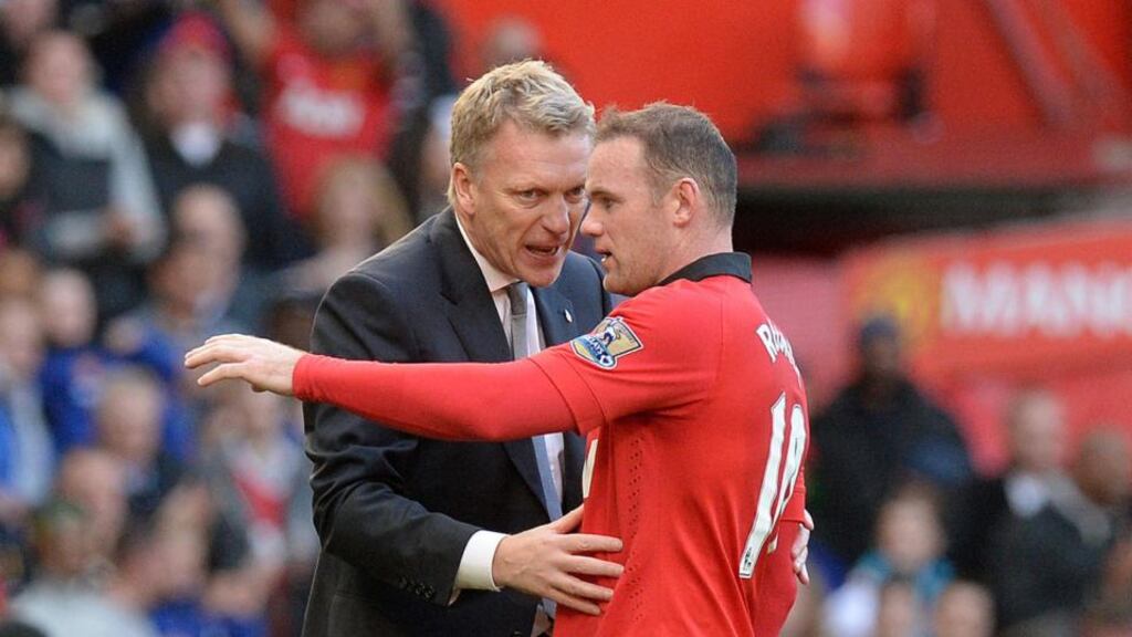 David Moyes with Wayne Rooney. Photo: Martin Rickett/PA