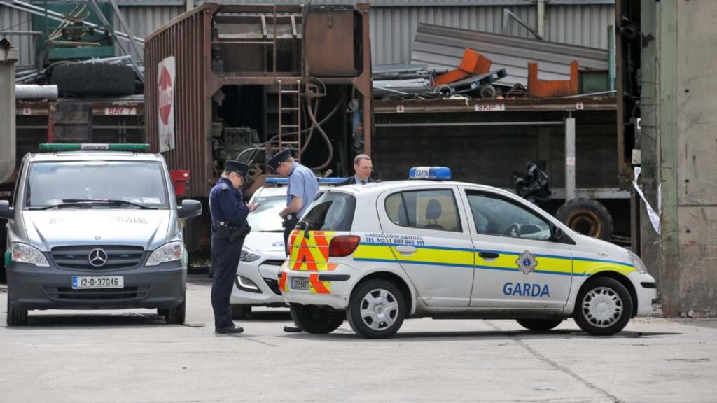 The body parts are removed from the scene at the Thorntons Recycling plant on Kileen Road, Ballyfermot, this afternoon. Photograph: Colin Keegan/Collins