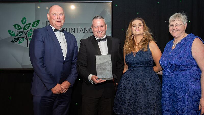 Mark Harris, regional and sectoral head of Business Banking, Permanent TSB, presents the Advisory Team of the Year – SME Finance award to the Paul O'Donovan & Associates team.