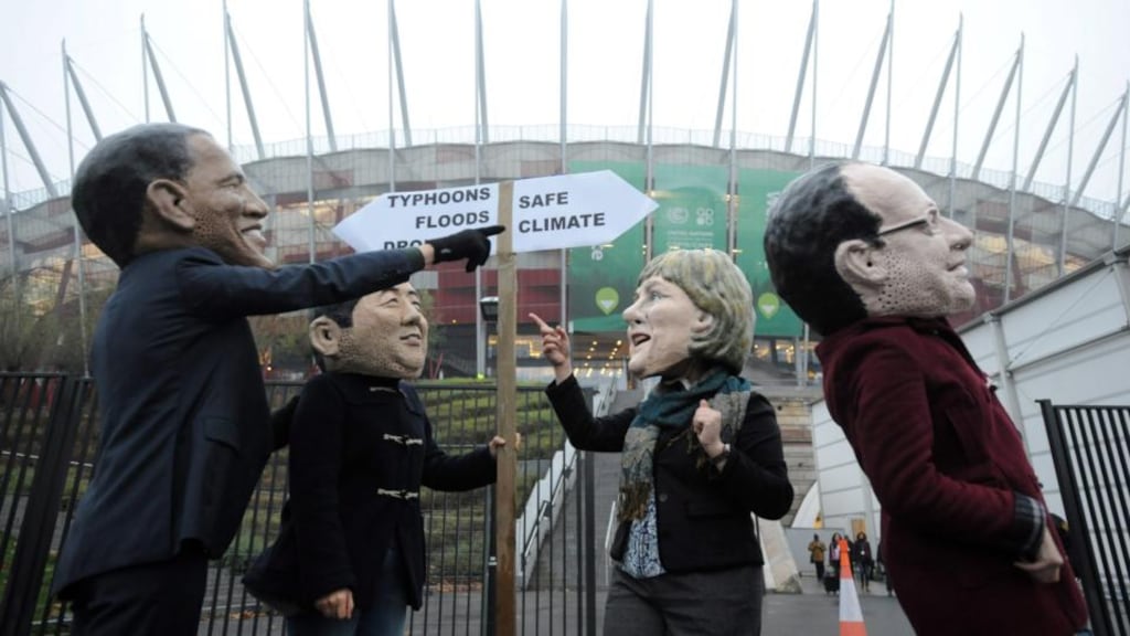 Protesters wearing leaders’ masks demonstrate in front of the National Stadium during the UN Climate Change Conference in Warsaw. Photograph: EPA/BartlomieJ Zborowski