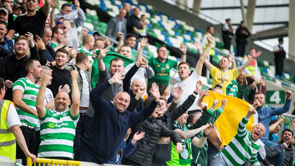 Celtic fans gesture to Linfield fans after their team broke the deadlock. Photo: Liam McBurney/PA Wire