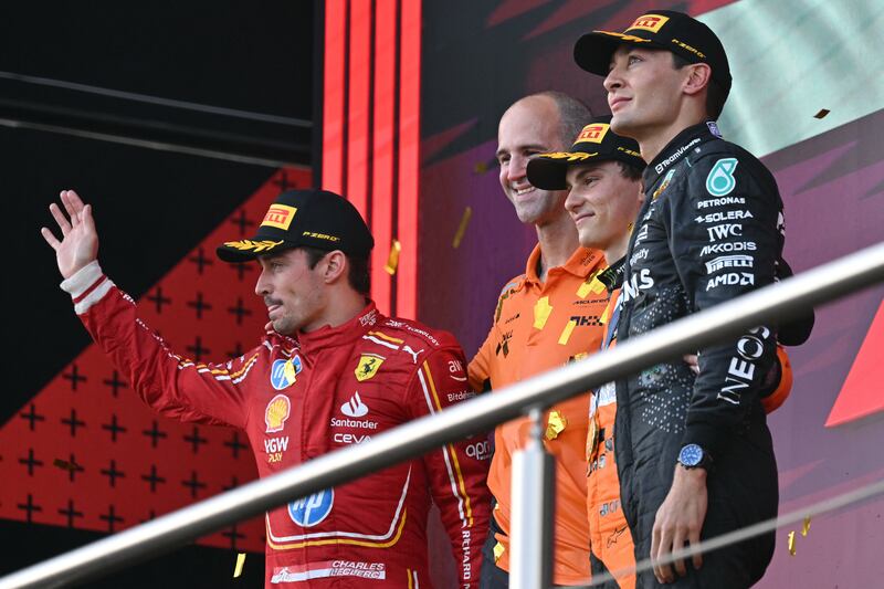McLaren's Oscar Piastri (centre) on the podium with Ferrari's Charles Leclerc (left) and Mercedes' George Russell after the Azerbaijan Grand Prix. Photo by Andrej Isakovic/AFP via Getty Images