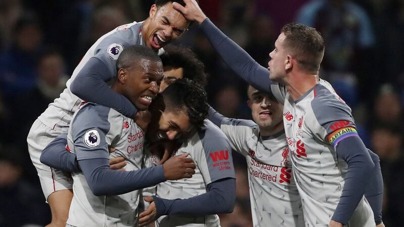 Liverpool’s Roberto Firmino celebrates scoring their second goal during the 3-1 Premier League win over Burnley. Photo: Scott Heppell/Reuters
