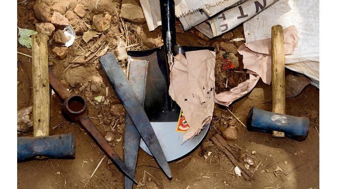 Workers use rudimentary tools