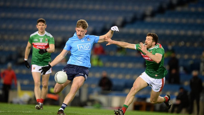 Dublin’s Seán Bugler is closely marked by Chris Barrett of Mayo during the All-Ireland final at Croke Park. Photograph: Dara Mac Dónaill