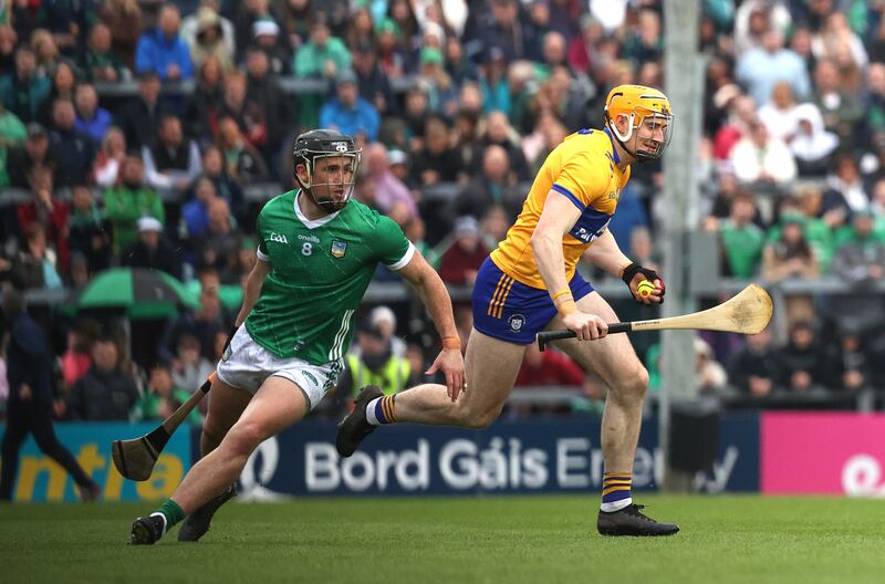 Limerick's Darragh O’Donovan and David Fitzgerald of Clare in action.
Photograph: Bryan Keane/Inpho