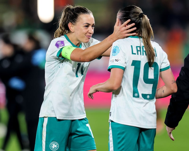 Ireland's Katie McCabe celebrates with Abbie Larkin after she scored her goal. Photograph: Ryan Byrne/Inpho