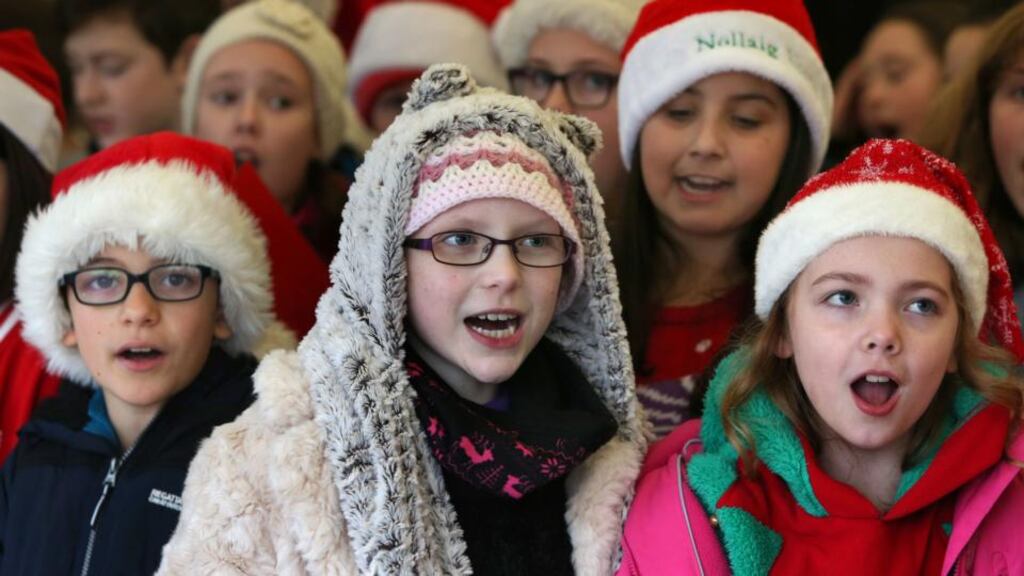 Grace Kenneally (centre), who has Neuroblastoma, a rare and aggressive children’s cancer, singing Christmas carols with her school friends from Gaelscoil Dara at the Live Crib outside Galway Cathedral. Photograph: Joe O’Shaughnessy.