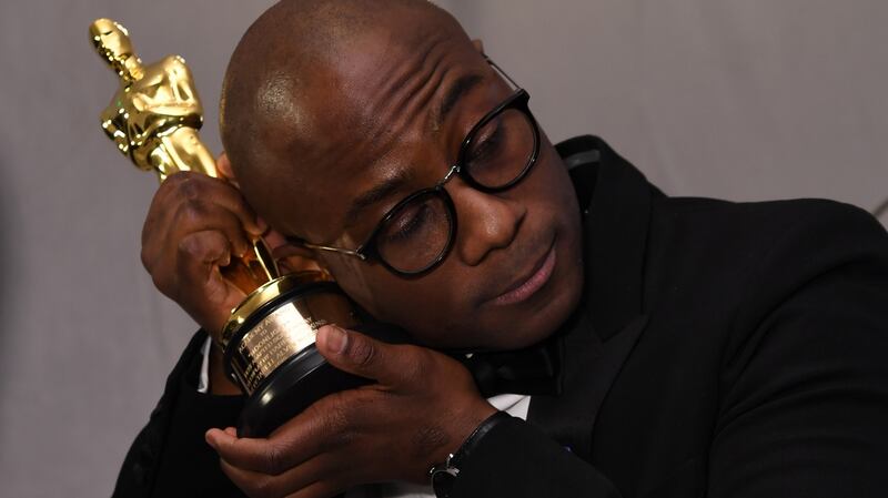 Winner for Best Director ‘Moonlight’ Barry Jenkins holds his trophy at the Governors Ball in Hollywood. Photograph: Angela Weiss/AFP/Getty