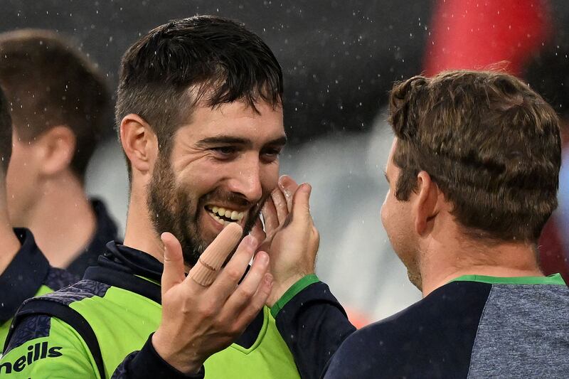 Andrew Balbirnie celebrates win with team-mates at MCG. Photograph: William West/AFP via Getty