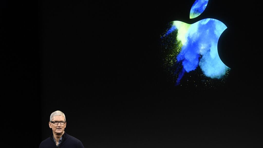 Apple chief executive Tim Cook: said the company is putting money in a holding account pending the outcome of its appeal against the European Commission ruling, Taoiseach Enda Kenny said. Photograph: David Paul Morris/Bloomberg