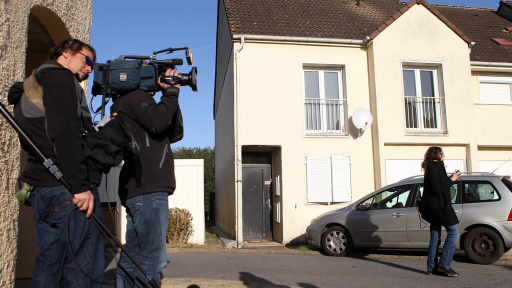 Journalists in front of the house in Chartres, France, where neighbours say Ismaël Omar Mostefaï, one of the three suspected attackers who killed almost 100 people at the Bataclan music venue in Paris, lived with his family until about two years ago. Photograph: Michel Spingler/AP