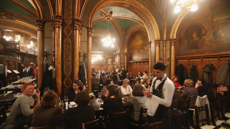 The bustling Caru’ cu Bere (Friends with Beer), the city’s oldest restaurant, opened in 1899. Photograph: Sean Gallup/Getty Images