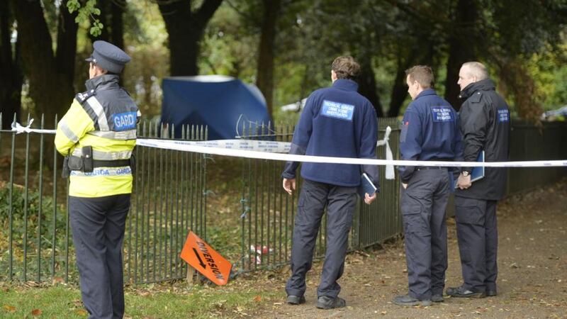 Members of the Gardai Technical Bureau Crime Scene Investigations unit arrive at the scene in the Phoenix Park, by the Wellington Monument, where the body of a man was found burned in a sleeping bag in the early hours of this morning. Photograph: Alan Betson/The Irish Times
