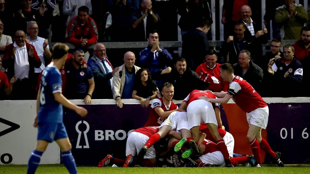 Conan Byrne of St Patrick’s Athletic celebrates scoring their second goal with his team-mates during the SSE Airtricity League Premier Division match against Limerick at Richmond Park. Photograph: Ryan Byrne/Inpho