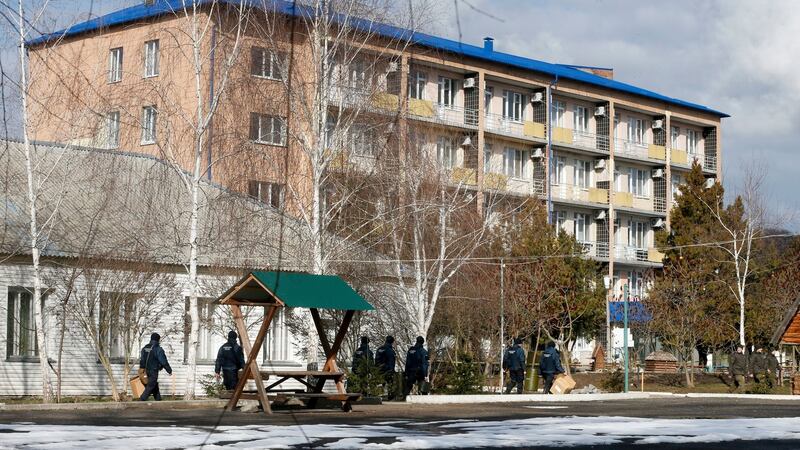 Ukrainian National Guards soldiers patrol an area at the sanitarium where the evacuees from the Chinese city of Wuhan are to be quarantined, in Novi Sanzhary village on Friday. Photograph: Efrem Lukatsky/PA
