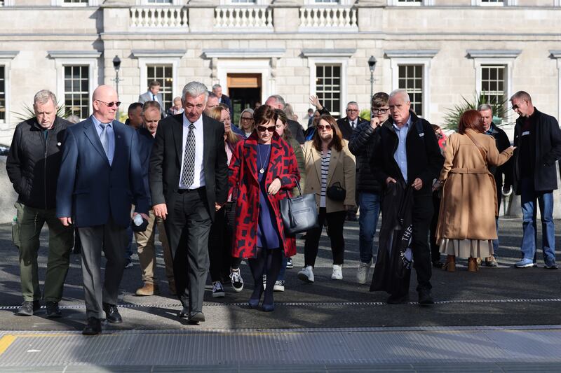 Stardust families and survivors leave the Dáil, after Taoiseach Simon Harris delivered a formal State apology to the families and to the victims of the Stardust fire tragedy. Photograph: Dara Mac Dónaill