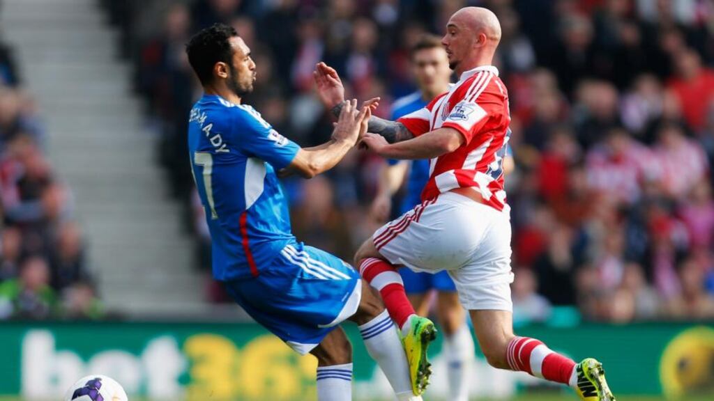 Ahmed Elmohamady of Hull City challenges Stephen Ireland of Stoke City during the Premier League match at the Britannia Stadium. Photograph: Paul Thomas/Getty Images