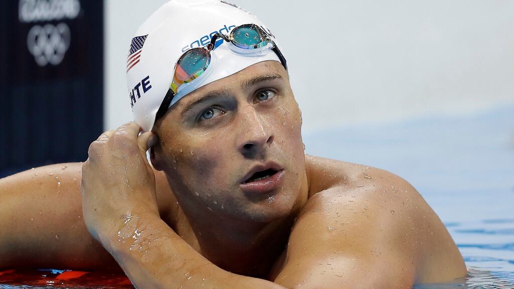 Ryan Lochte (above) and three other American swimmers were robbed at gunpoint early on Sunday by thieves posing as police officers who stopped their taxi and took their money and belongings, the U.S. Olympic Committee said. Photograph: Michael Sohn/AP
