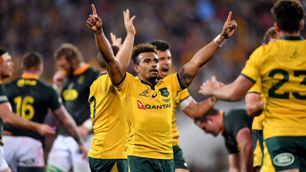 Will Genia Australia celebrates their victory over South Africa in the Rugby Championship. Photo: Darren England/EPA