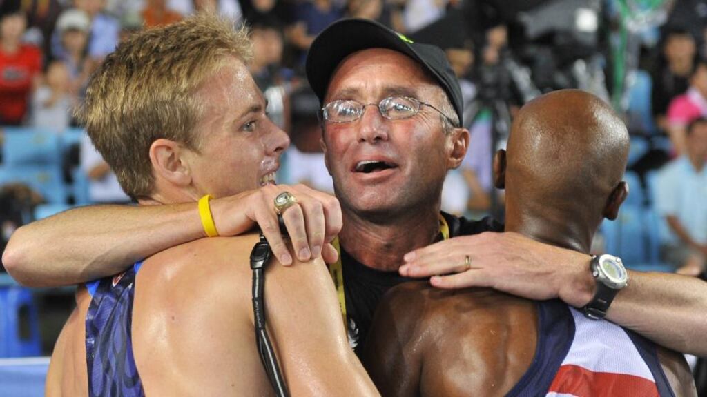 A September 4th, 2011, photograph shows Alberto Salazar (C) hugging US athletes Bernard Lagat (R) and Galen Rupp following the men’s 5,000 metres final at the World Championships in Daegu. Photograph: Getty Images