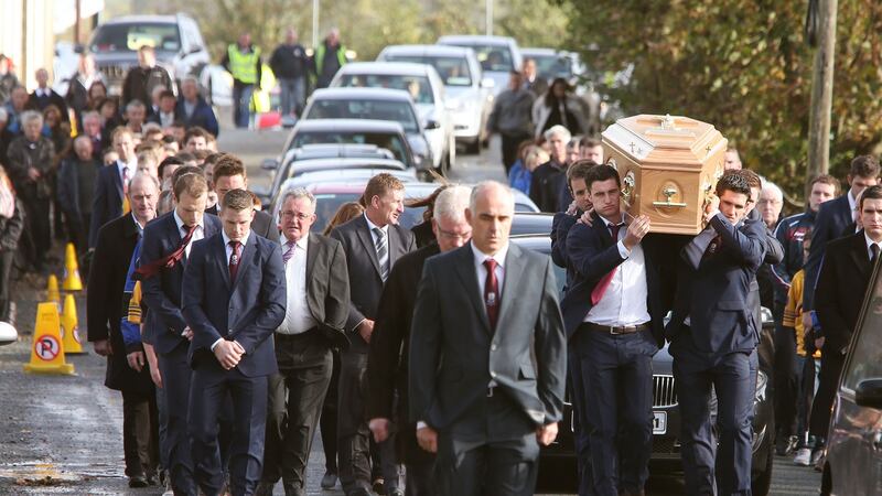 The remains of Niall Donohue are carried by hurling colleagues through Kilbeacanty. Photograph: Joe O’Shaughnessy