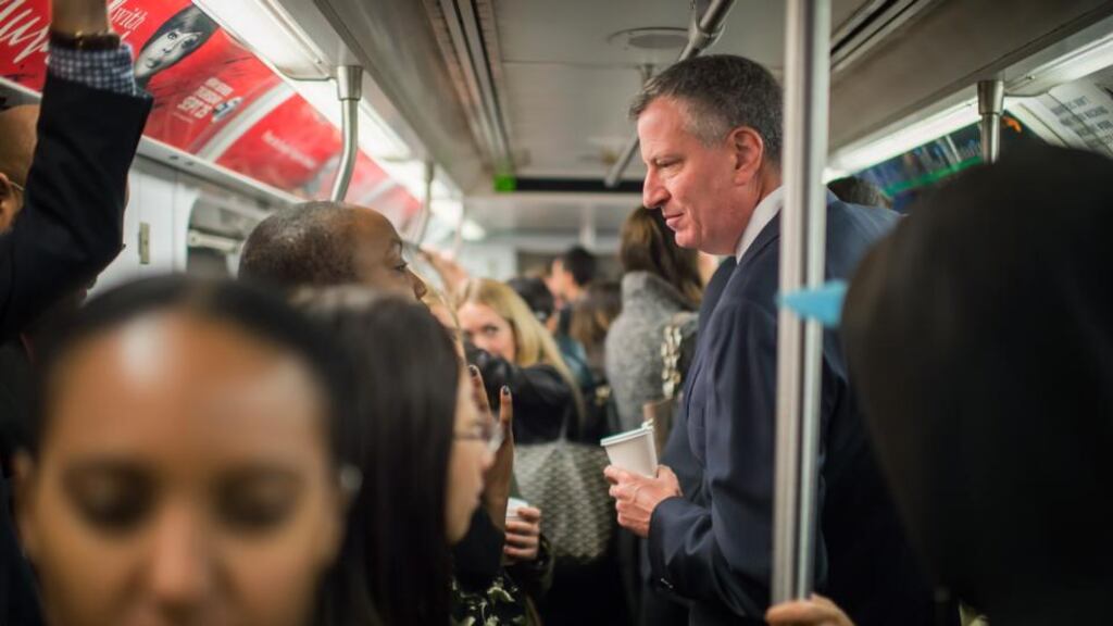 Mayor Bill de Blasio takes the subway on his route to City Hall in New York City yesterday. Many New Yorkers riding subway trains are uneasy. Photograph: Rob Bennett/Office of Mayor of New York/Getty Images