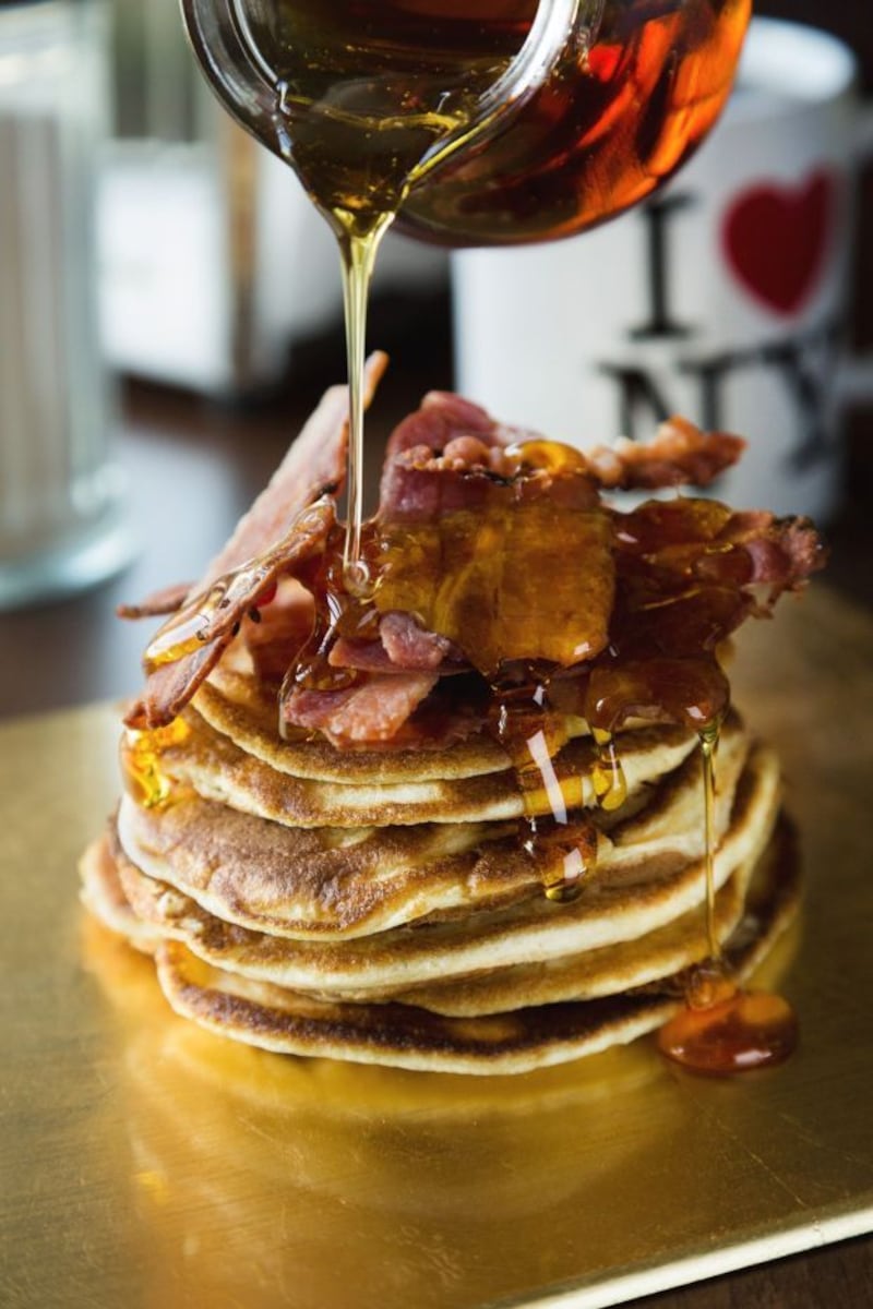Buttermilk pancake stack with bacon and maple syrup