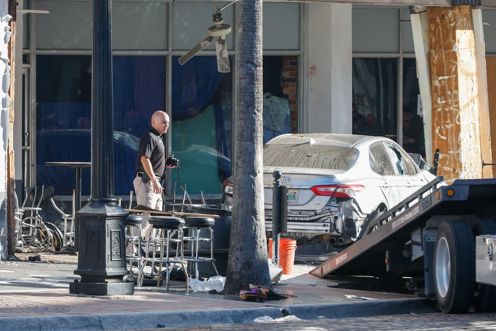 Police investigate the scene after after a speeding driver crashed into a group of people outside Bradley’s on 7th, Tampa, Florida, on Saturday. Photograph: Jefferee Woo/Tampa Bay Times via AP