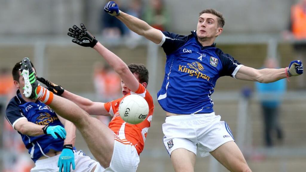 Cavan’s Killian Clarke and Killian Brady contest a for a high ball with with Ethan Rafferty of Armagh during the Ulster Senior Football Championship preliminary round at Breffini Park. Photograph: Ryan Byrne/Inpho