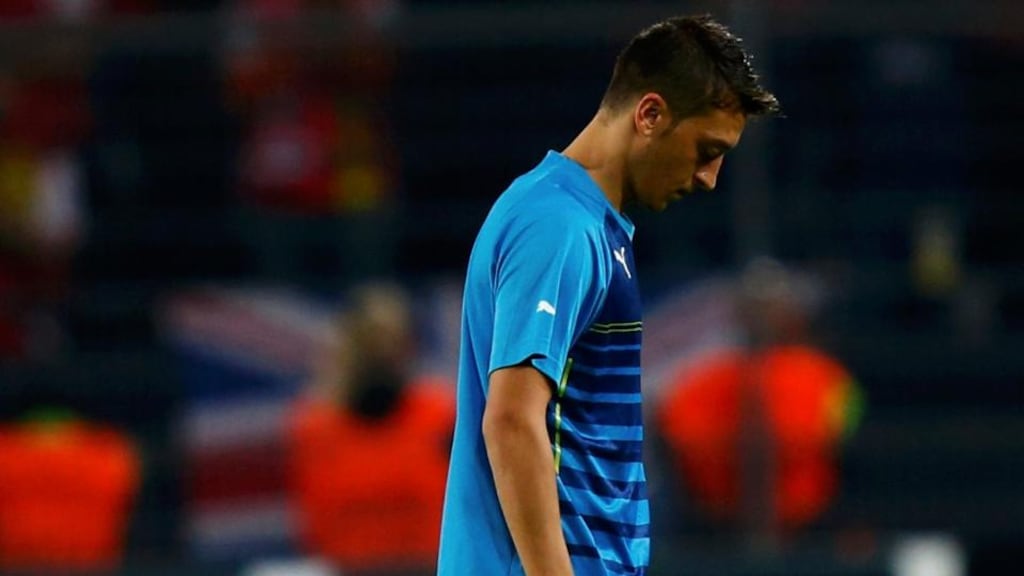 Arsenal’s Mesut Oezil leaves the pitch dejected after losing to Borussia Dortmund in their Champions League group D soccer match in Dortmund. Photograph: Ralph Orlowski/Reuters