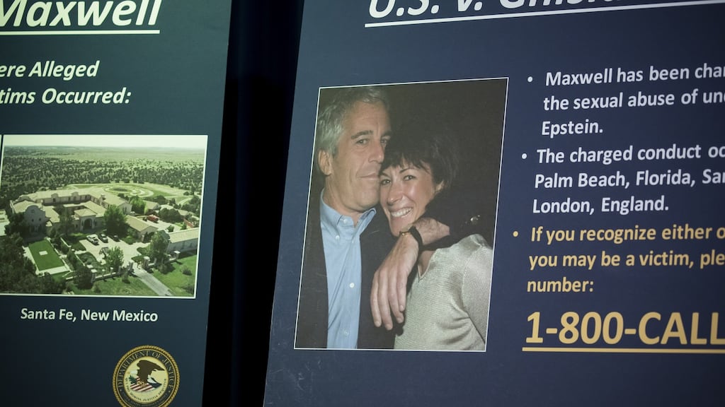 A photograph of Ghislaine Maxwell and Jeffrey Epstein is displayed during a news conference. Photograph: Michael Nagle/Bloomberg