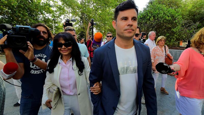 Javier Sanchez Santos (C) arrives with his mother Maria Edite Santos (L) to appear to the court of Valencia before a hearing to examine his paternity claim. Photograph: Jose Jordan/ AFP/Getty Images